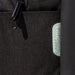 Swissdigital Arosa Backpack - A close-up of a black backpack featuring a textured fabric and a logo patch.