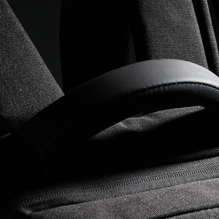 Swissdigital Arosa Backpack - A black backpack featuring padded straps and textured fabric, with a small logo visible.