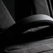 Swissdigital Arosa Backpack - A black backpack featuring padded straps and textured fabric, with a small logo visible.
