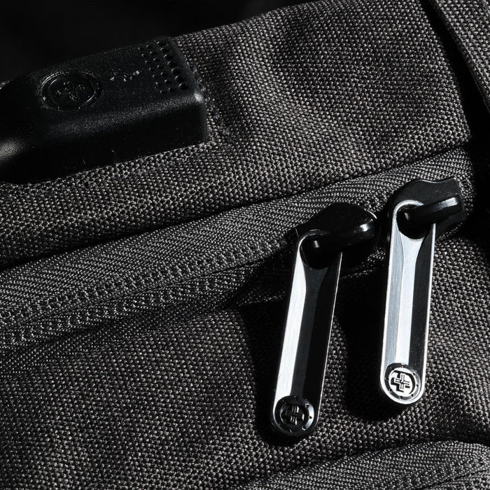 Swissdigital Arosa Backpack - A close-up of a black Swissdigital Arosa Backpack featuring sturdy zippers and a logo on the fabric.