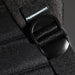 Swissdigital Arosa Backpack - A detailed close-up of a black backpack strap featuring a plastic buckle, showcasing its durable materials and design.