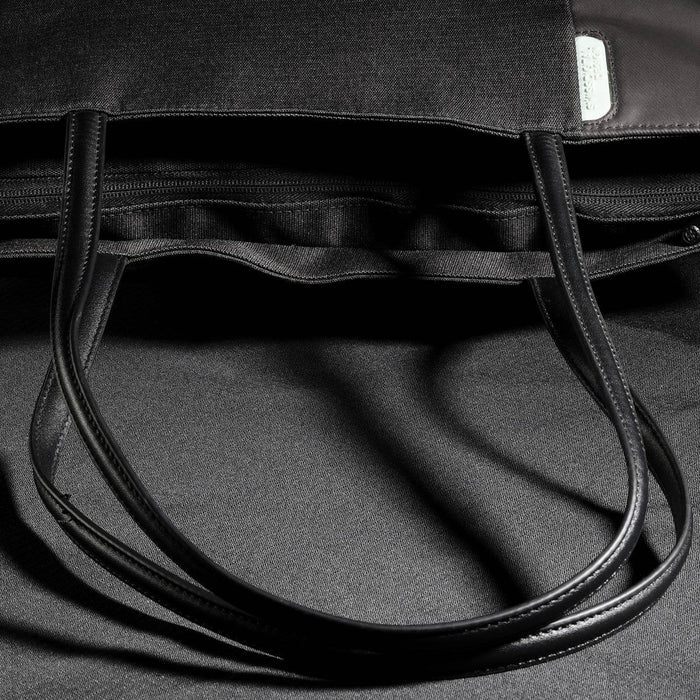 Swissdigital Arosa Tote Bag - A black tote bag with long handles, featuring a zippered opening and an interior lining.