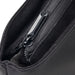 Swissdigital Arosa Tote Bag - A close-up of a black tote bag's zippered pocket, showcasing its fabric texture and zipper details.