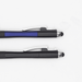 The Ironhide Pen - A close-up of two black pens with a blue accent and silver details, featuring a stylus tip and retractable design.