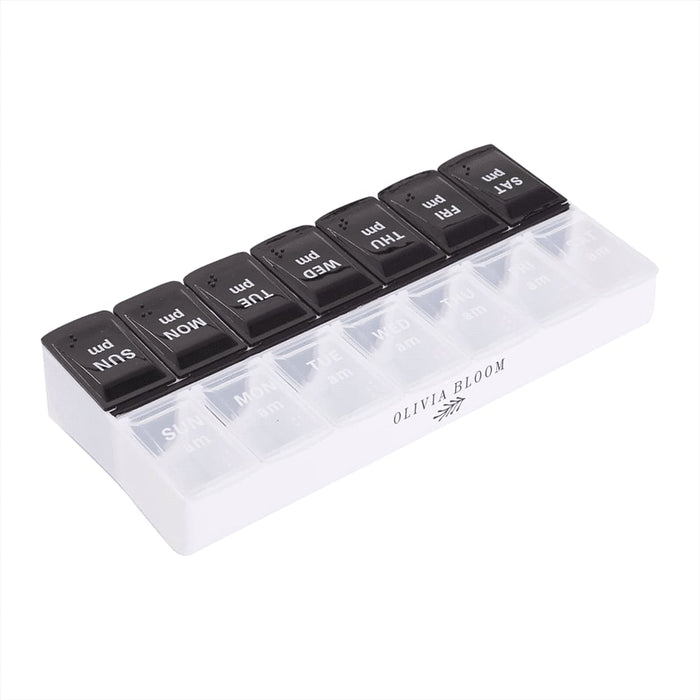 Recycled AM/PM Pill Case - A transparent AM/PM pill case with black lids labelled for each day of the week. It features a logo on the side.