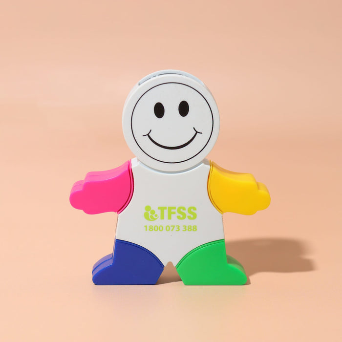 Little Guy Highlighter - A smiling character-shaped highlighter with pink, yellow, green, and blue colours, featuring a logo on the front.