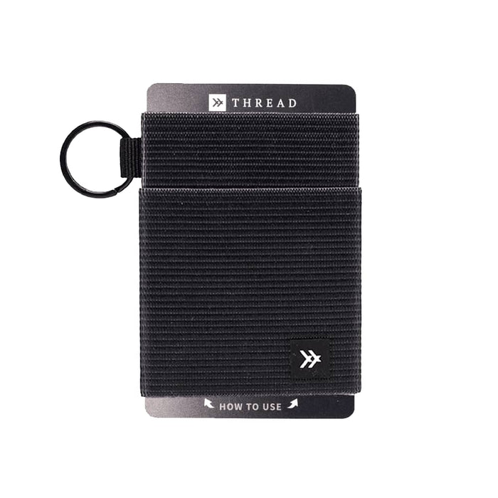 Thread Elastic Wallet - A black Thread Elastic Wallet features a textured design and includes a keyring attachment. It has a branding logo.