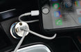 Spirit Techno Kit - A phone charging cable connected to a silver car charger, with a smartphone displaying apps and notifications.