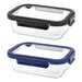 Trekk Crib Glass Lunch Box - A glass lunch box with a clear body and black and navy blue lids, featuring a secure locking mechanism and a logo.