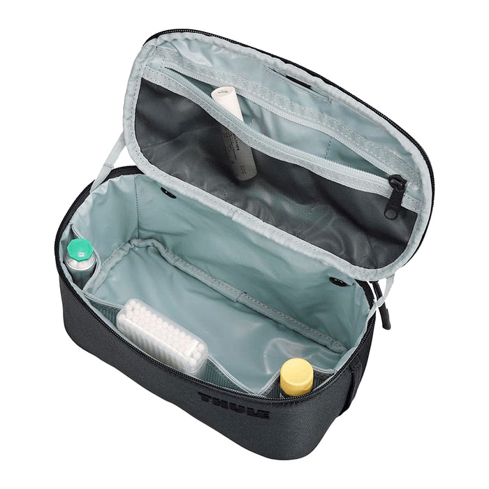 Thule Subterra 2 Toiletry Bag w/ Removable Pouch - A grey toiletry bag with a removable pouch, featuring multiple compartments and a splash-proof interior.