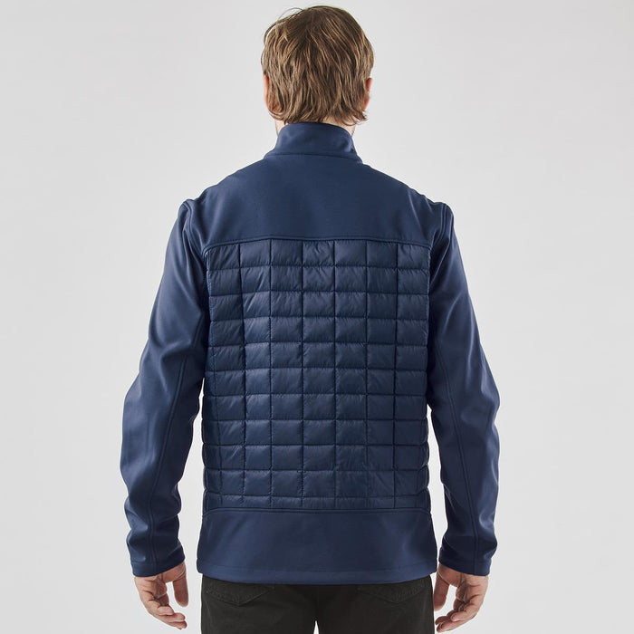 Men's Appalachian Thermal Softshell Jacket - A navy blue men's softshell jacket with a quilted back and raised collar, featuring a logo on the upper left.