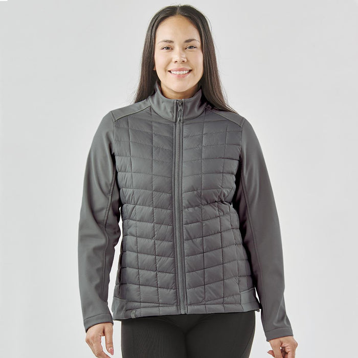 Women's Appalachian Thermal Softshell Jacket - A grey women's softshell jacket with a quilted front and a zip-up design, featuring a logo on the chest.