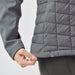 Women's Appalachian Thermal Softshell Jacket - A grey women's thermal softshell jacket featuring a quilted design and a logo at the hem.