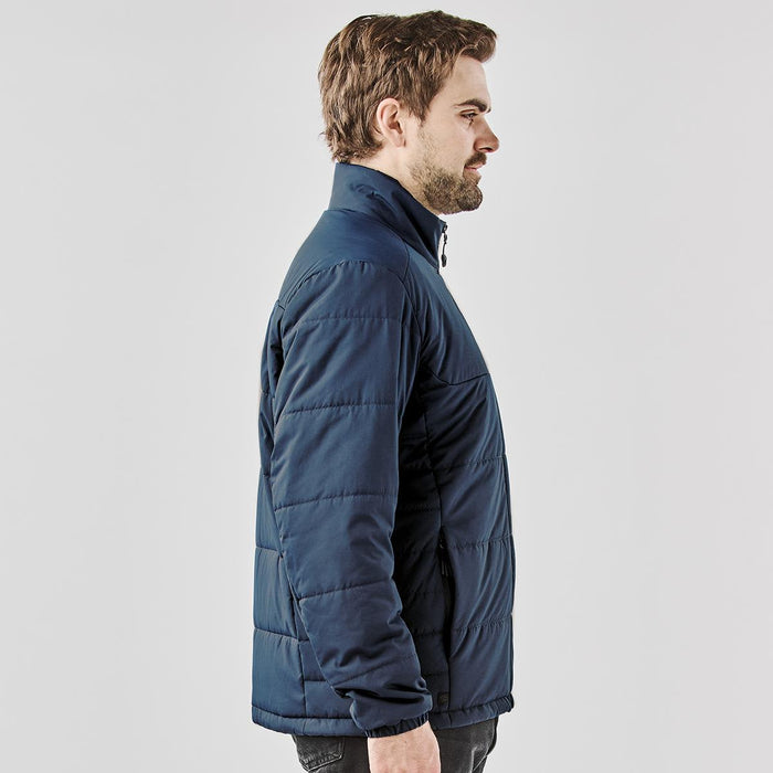 Men's Sierra Thermal Jacket - A navy blue puffer jacket with a collar, featuring a side profile view of a man wearing it.