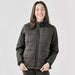 Women's Sierra Thermal Jacket - A black women's puffer jacket with a zip-up front and a classic design. It features a logo on the chest.