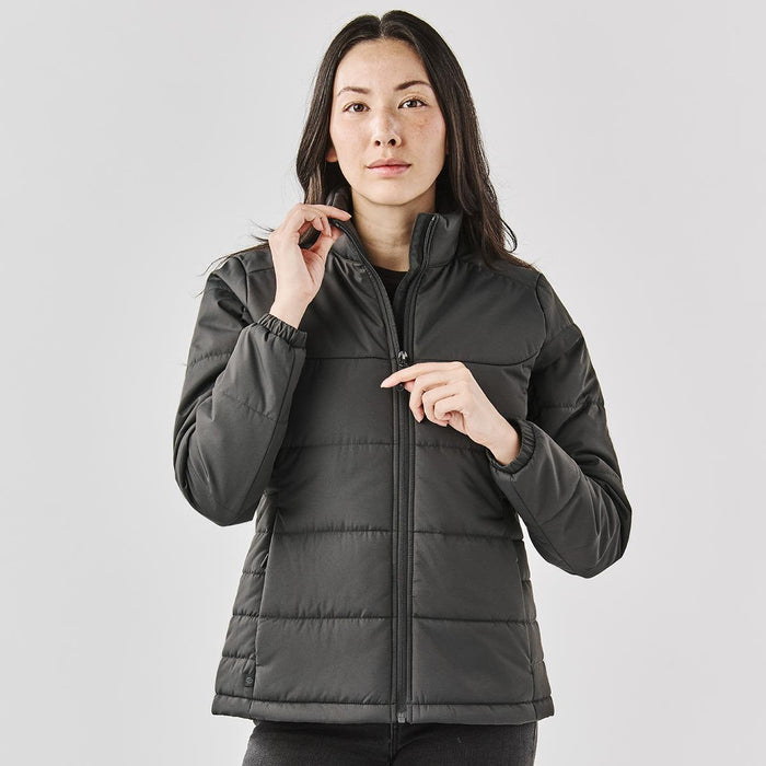 Women's Sierra Thermal Jacket - A black puffer jacket with a zip, featuring a high collar and a fitted design. It has a logo on the sleeve.