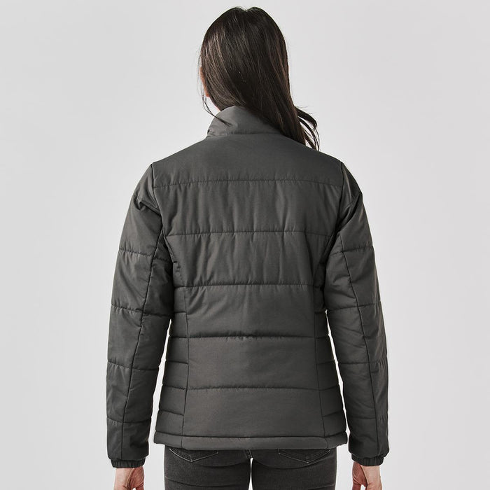 Women's Sierra Thermal Jacket - A women's puffer jacket in dark grey, featuring a quilted design and a high collar. It includes a logo on the back.