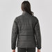 Women's Sierra Thermal Jacket - A women's puffer jacket in dark grey, featuring a quilted design and a high collar. It includes a logo on the back.
