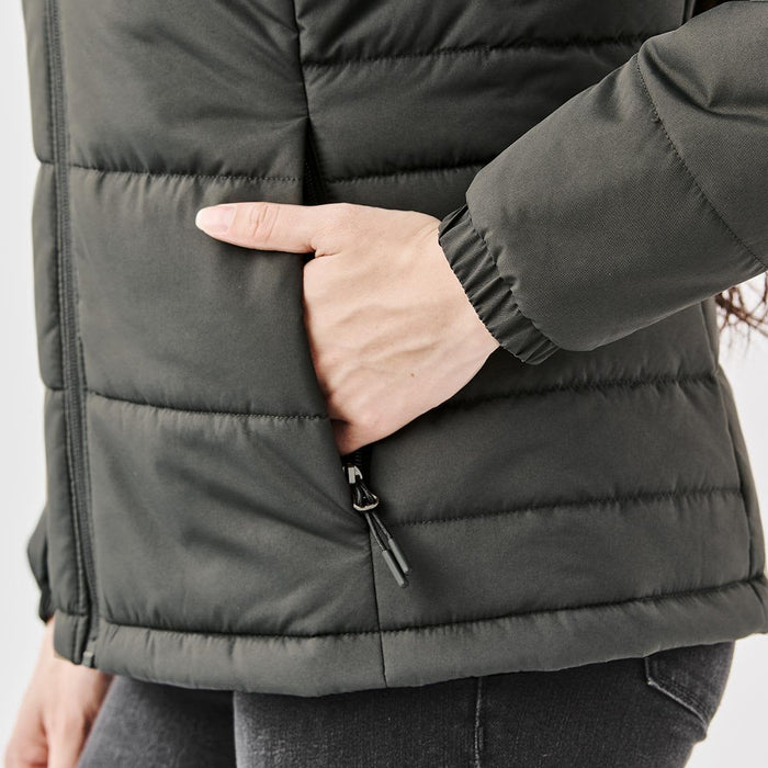 Women's Sierra Thermal Jacket - A women's dark green puffer jacket featuring a side pocket and quilted design. It has a fitted silhouette.