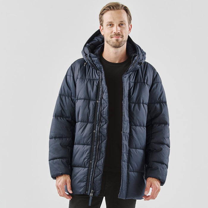 Men's Elkridge Parka - A navy blue puffer jacket with a hood, featuring a zip closure and a relaxed fit. It has a logo on the garment.