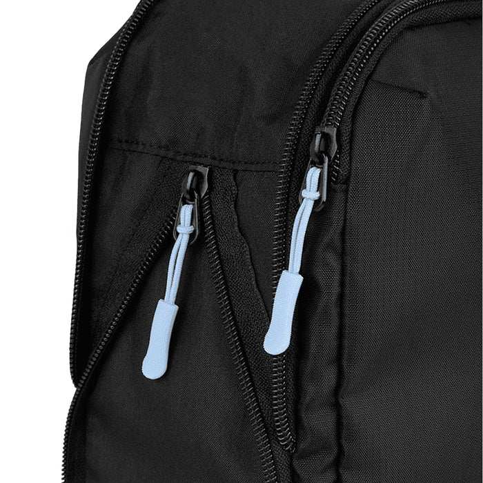 Wander & Roam Compression Packing Cube Set - A black packing cube with blue zipper pulls, showcasing a close-up of its textured fabric and zippers.