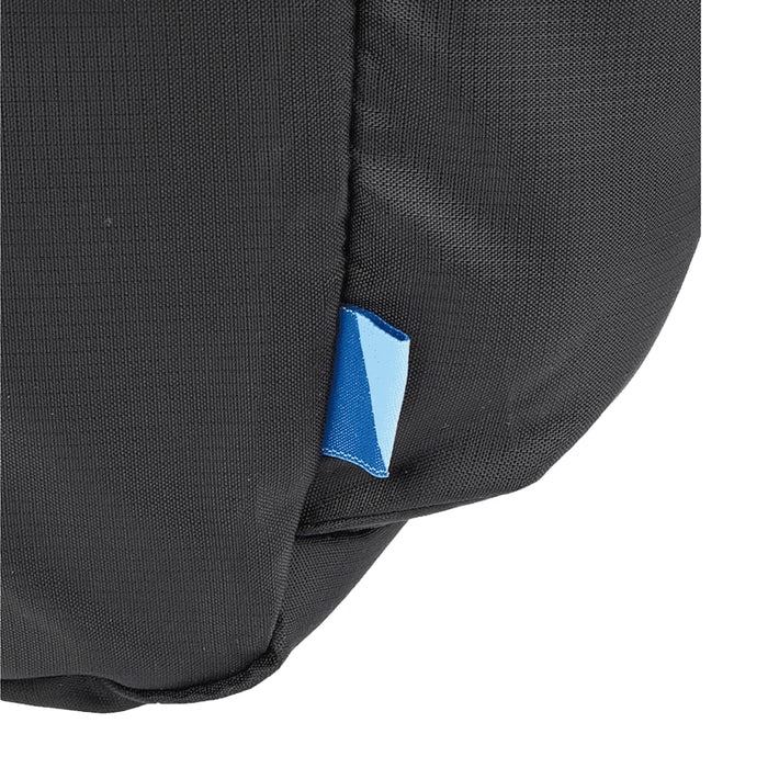 Wander & Roam Packable Travel Duffel Bag - A packable travel duffel bag in black with a small blue tag, featuring a simple and durable design.