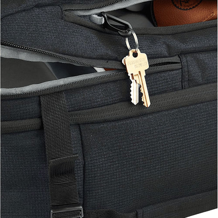 Wander & Roam Travel Backpack - A black travel backpack featuring a keychain with keys inside a zippered compartment. The interior is grey.